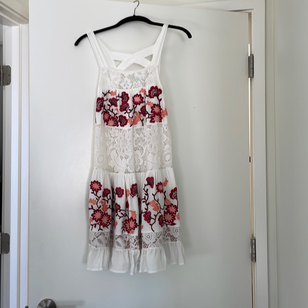 Summer dress by For love of lemons. Lace and flower detail. Flowy. True to size.